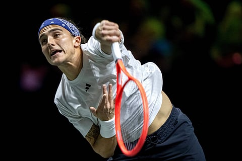 Italy's Mattia Bellucci returns a shot against Russia's Daniil Medvedev on the third day of the ATP500 Rotterdam Open tennis tournament at the Ahoy venue in Rotterdam, on February 5.