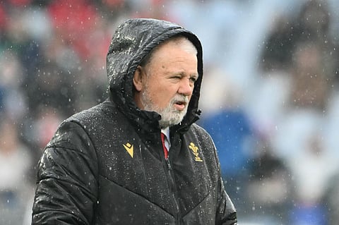 Wales' coach Warren Gatland reacts under the rain prior to the start of the Six Nations international rugby union match against Italy at Stadio Olimpico in Rome on February 8.