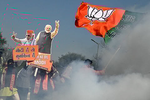 Supporters of the Bharatiya Janata Party (BJP) celebrate as BJP emerged as the largest party in Delhi legislative assembly election on February 8, 2025.