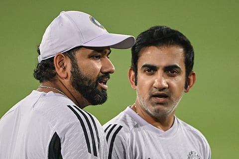 Head coach Gautam Gambhir (right) speaks to former captain Rohit Sharma.