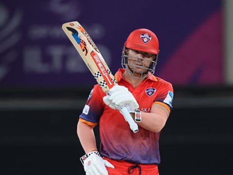 David Warner of Dubai Capitals celebrates his half-century against Abu Dhabi Knight Riders in DP World ILT20 Season 3 in Dubai.