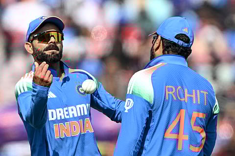 India's Virat Kohli (L) with Rohit Sharma.