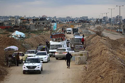 Displaced Palestinians cross the Netzarim corridor as they make their way to the northern parts of the Gaza Strip on February 9, 2025.