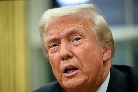 US President Donald Trump speaks to the press after signing an executive order in the Oval Office of the White House in Washington, DC, on February 10, 2025.