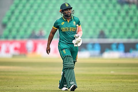 South Africa's captain Temba Bavuma walks back to the pavilion after his dismissal during the Tri-Nation series second ODI cricket match against New Zealand at the Gaddafi Stadium in Lahore on February 10, 2025.