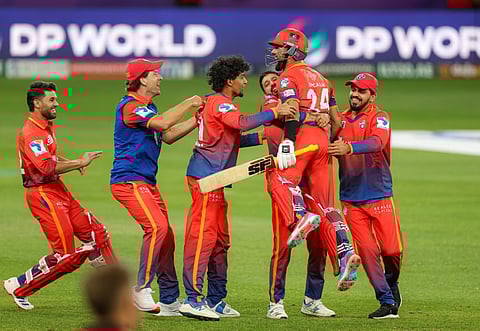 Dubai Capitals players celebrate after winning the 3rd edition of DP World ILT20 at Dubai International stadium on Sunday.
