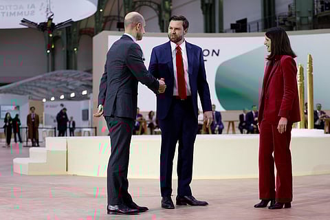France's Minister for Europe and Foreign Affairs Jean-Noel Barrot, US vice-president J.D. Vance and Secretary of State for AI and Digital Technology Clara Chappaz pose before a plenary session at the Artificial Intelligence (AI) Action Summit, at the Grand Palais, in Paris, on February 11, 2025.