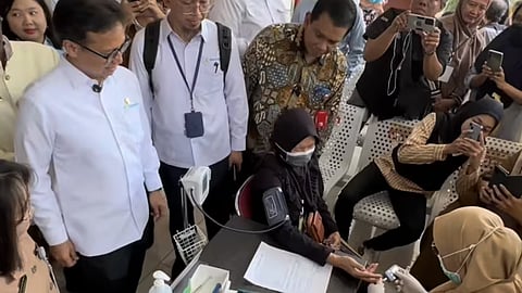 Indonesia's Health Minister Budi Gunadi Sadikin (left) inspecting the programme's implementation on Feb 10, 2025. Under the new scheme, every Indonesian will receive a health voucher for a free medical screening, claimable during or up to a month after their birthday.