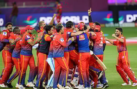 Dubai Capitals players celebrate after winning defeating Desert Vipers in the DP World ILT20 Season 3 final in Dubai.