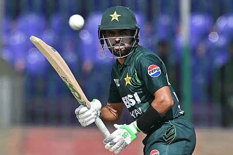 Pakistan's Babar Azam watches the ball after playing a shot during the Tri-Nation series final one-day international (ODI) cricket match between Pakistan and New Zealand at the National Stadium in Karachi on February 14, 2025.