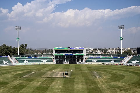 A groundsman uses a roller to prepare the pitch ahead of the ICC Men's Champions Trophy One-Day International (ODI) cricket matches at the Rawalpindi Cricket Stadium in Rawalpindi on February 17.