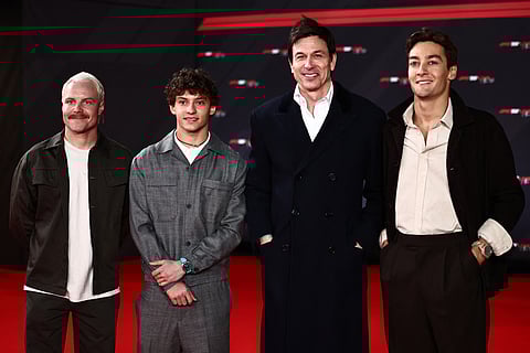 Mercedes' Finish driver Valtteri Bottas, Mercedes' Italian driver Andrea Kimi Antonelli, Mercedes' Austrian team principal Toto Wolff and Mercedes' British driver George Russell pose on the red carpet upon arrival for the Formula One - 2025 season launch “F1 75 LIVE” event at the O2, in London, on February 18.