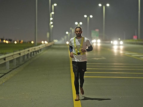 Indian expat and ultra-marathoner Aakash Nambiar running bare feet.