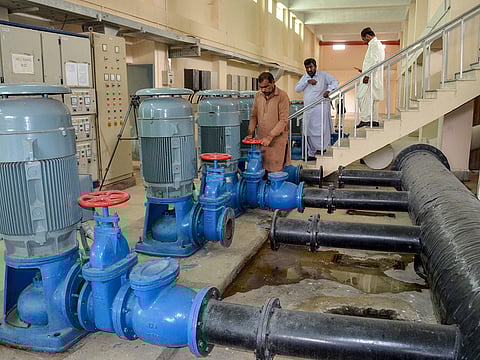 Technical staff work at the USAID-funded Pakistani non-profit HANDS water supply plant in Jacobabad in southern Sindh province on February 18, 2025.