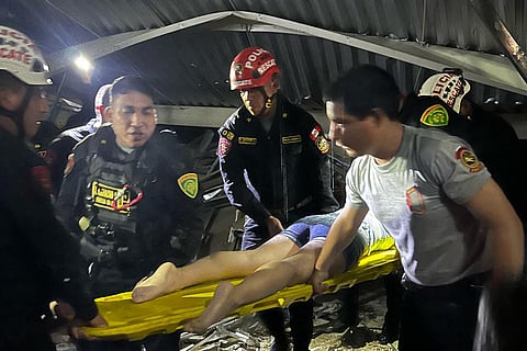 Rescue teams working at the scene of an accident in which a roof of a food court collapsed in a shopping mall in Trujillo, Peru.
