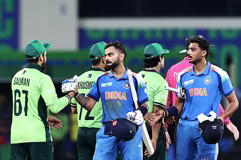 India's Virat Kohli and Axar Patel shake hands with Pakistan's players after winning the Champions Trophy match in Dubai on February 23. The two teams will be facing each other on September 14.