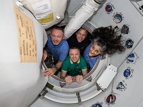 This photo provided by NASA shows the four crew members of NASA’s SpaceX Crew-9 mission, including NASA astronauts Nick Hague, Suni Williams, and Butch Wilmore, along with Roscosmos cosmonaut Aleksandr Gorbunov, posing for a photo aboard the International Space Station on February 26, 2025.