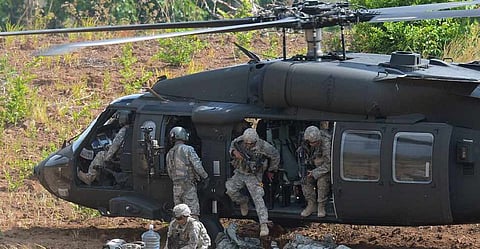Filipino troops hop off a "Black Hawk" helicopter during a training exercise. File photo