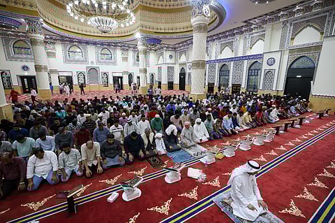 The faithful perform prayers after Iftar on the first day of Ramadan at Al Farooq Omar bin Al Khattab Mosque (Blue Mosque) in Dubai.