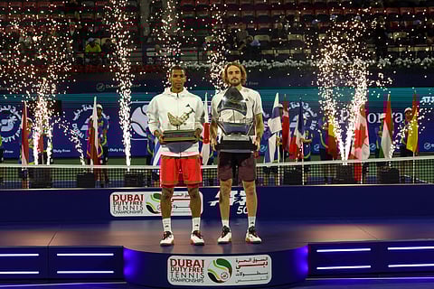 Stefanos Tsitsipas (right) of Greece with Félix Auger-Aliassime duing the presentation ceremony after the Dubai Duty Free Tennis Championships final on Saturday.