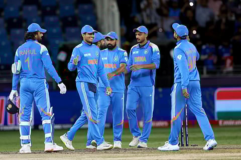 Indian players celebrate their victory against New Zealand during the Champions Trophy match at Dubai International Stadium on Sunday.