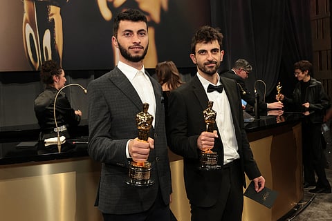 Basel Adra and Yuval Abraham winners of the Best Documentary Feature award for "No Other Land" attend the 97th Annual Oscars Governors Ball at Ovation Hollywood Complex on March 02, 2025 in Hollywood, California.
