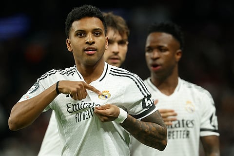 Real Madrid's Brazilian forward Rodrygo celebrates scoring the opening goal in the Madrid derby