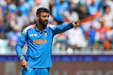 India's Varun Chakravarthy celebrates after a wicket during the Champions Trophy at Dubai International stadium.