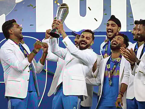 India’s players celebrate with the trophy after winning the ICC Champions Trophy at the Dubai International Stadium in Dubai on March 9.