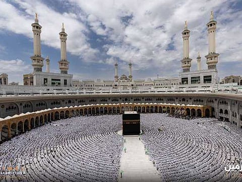Worshippers and pilgrims cramming the courtyard around the Holy Kaaba in the Grand Mosque during the Friday prayers.