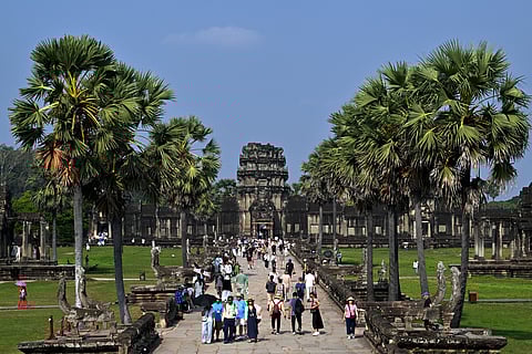 Tourists visit the Angkor Wat temple in Siem Reap province on March 15, 2025.