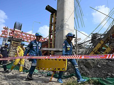 Emergency rescue workers carry a stretcher at the site of a crane collapse at a construction site along Rama II highway in Bangkok on March 15, 2025.
