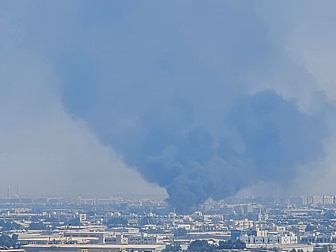 The smoke from the scrap yard fire in Sharjah Industrial Area 10.