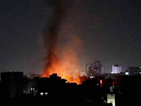This image grab from an AFPTV footage shows smoke plumes rising above buildings following bombardment on Yemen's Houthi-controlled capital Sanaa on March 19, 2025. Huthi media reported multiple US strikes on March 19 in rebel-held areas around Yemen including the capital Sanaa, as the US military said its campaign against the Iran-backed rebels was ongoing.