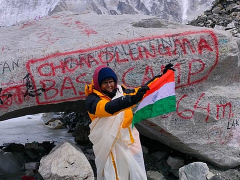Vasanthi Cheruveettil waves the Indian flat at the Everest Base Camp.