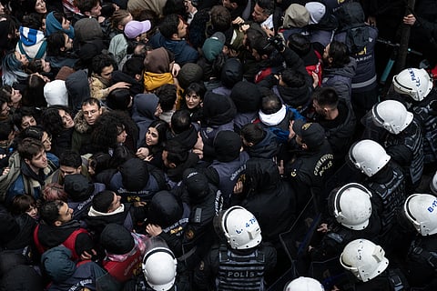 Protesters scuffle with Turkish anti-riot police during a University student march at Besiktas district in Istanbul on March 20, 2025 following Istanbul metropolitan Mayor Ekrem Imamoglu's detention over a corruption probe.