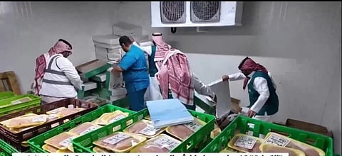 Inspectors check a cache of suspected rotten poultry and fake labels in Riyadh.