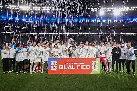 New Zealand's team celebrate after their victory during the Fifa World Cup 2026 Oceania qualifiers group final football match against New Caledonia at Eden Park Stadium in Auckland on March 24.