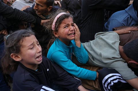 Relatives mourn Palestinian journalist Hussam Shabat, who collaborated with Al Jazeera Mubasher, during his funeral at the Indonesian Hospital in Beit Lahia, northern Gaza Strip, on March 24, 2025.