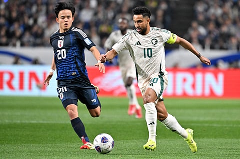 Saudi Arabia's forward Salem al Dawsari (right) fights for the ball with Japan's midfielders Takefusa Kubo during the 2026 Fifa World Cup Asian qualification football match in Saitama on March 25.