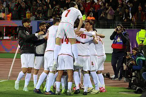 Iran's players celebrate after scoring during the FIFA World Cup 2026 Asia zone qualifiers group A football match between Iran and Uzbekistan, on March 25, 2025 in Tehran.