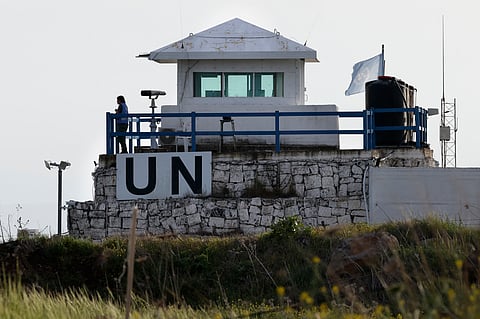 A member of the United Nations UN peace forces stands at a watchtower overlooking south Syria in the Israel-annexed Golan Heights, on March 25, 2025.