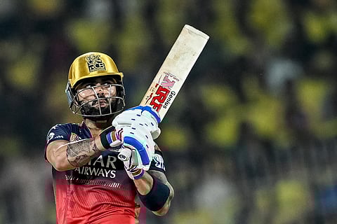 Royal Challengers Bengaluru's Virat Kohli watches the ball after playing a shot during the Indian Premier League (IPL) Twenty20 cricket match against Chennai Super Kings at the MA Chidambaram Stadium in Chennai on March 28.