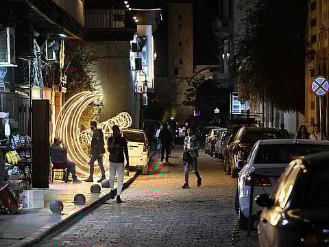 Syrians walk down a street in Old Damascus' Bab Sharqi neighbourhood on March 28, 2025.