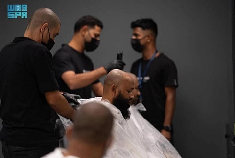 The barbershop has 170 chairs and can serve over 15,000 pilgrims daily, with each service averaging just three minutes.