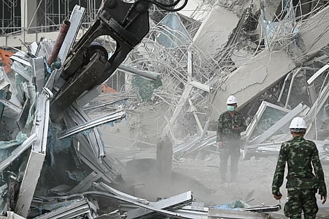 Machinery is used to remove debris at the site of an under-construction building collapse in Bangkok on March 29, 2025, a day after an earthquake struck central Myanmar and Thailand.