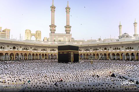 Worshippers perform the Eid prayer early on the first day of Eid Al Fitr feast in the courtyard around the Holy Kaaba in the Grand Mosque in Mecca.