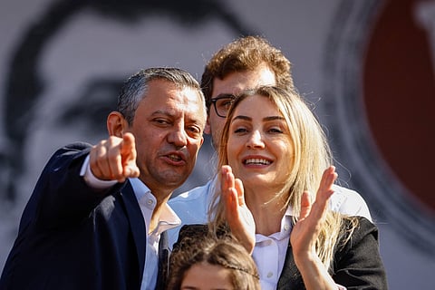Ozgur Ozel (left), leader of Turkey's main opposition Republican People's Party (CHP) gestures next to Dilek Kaya Imamoglu, the wife of Istanbul's arrested mayor Ekrem Imanoglu, during a rally called by CHP in support of Imanoglu in Maltepe, on the outskirts of Istanbul on March 29, 2025.