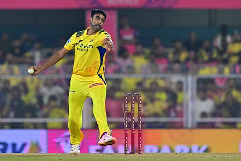 Chennai Super Kings' Ravichandran Ashwin bowls during the Indian Premier League (IPL) Twenty20 cricket match at the Barsapara Cricket Stadium in Guwahati on March 30, 2025.