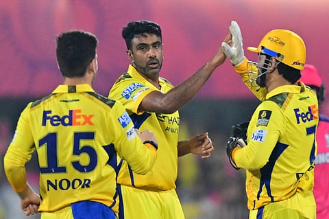 Chennai Super Kings' Ravichandran Ashwin (centre) celebrates with teammates Mahendra Singh Dhoni (right) and Noor Ahmad during the Indian Premier League 2025.